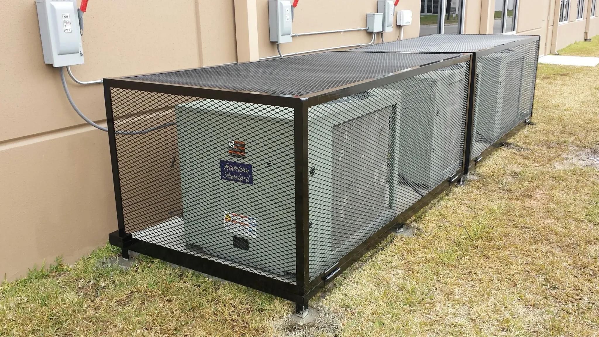 Custom welded protective AC equipment cage